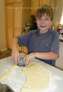 cutting out english muffin dough